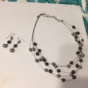 Silver and black necklace and earrings set